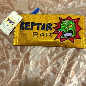 Gold multi-colored glitter Rugrats zip pouch by Danielle Nicole.